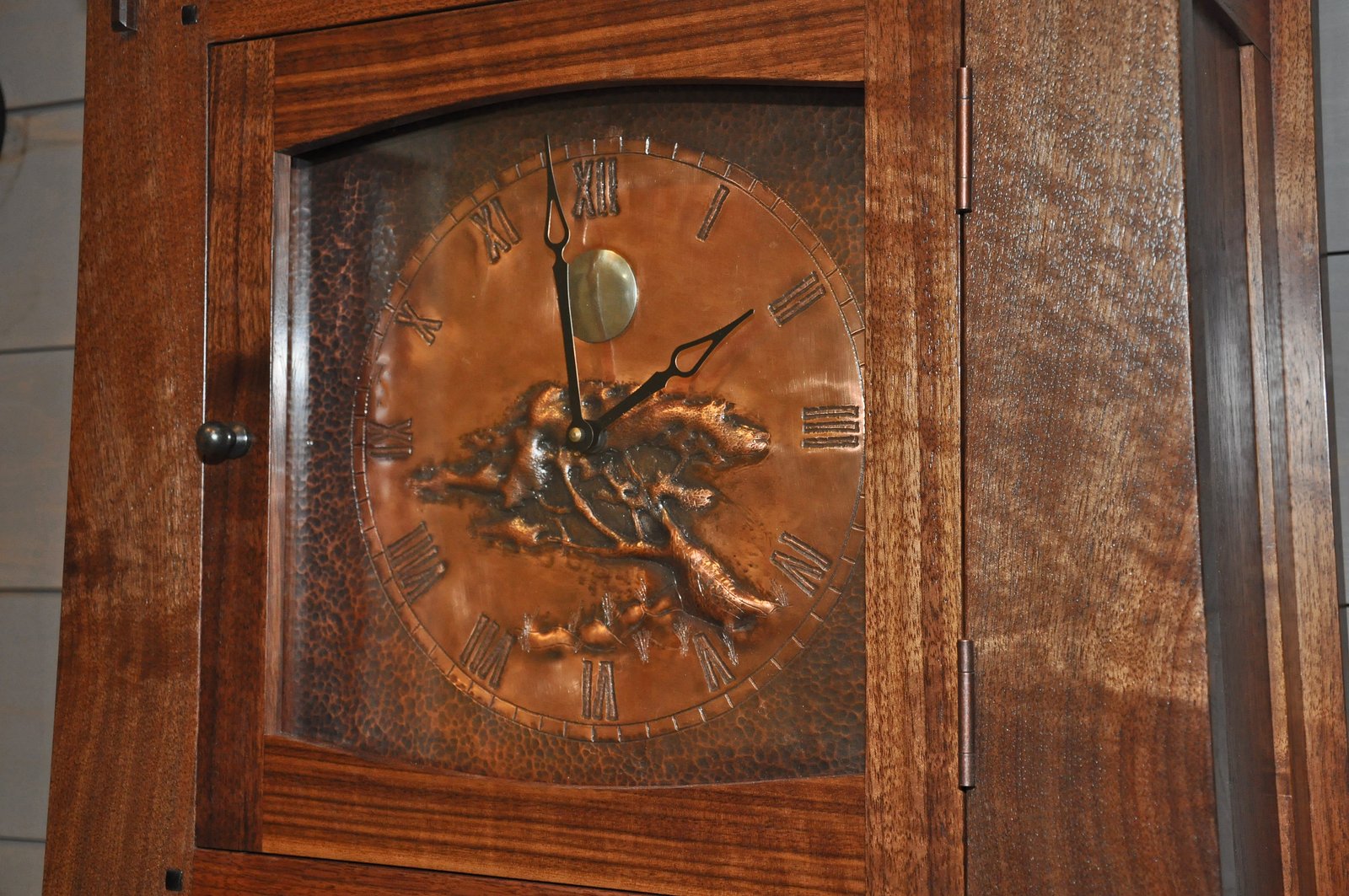 Detail of the walnut grandfather clock
